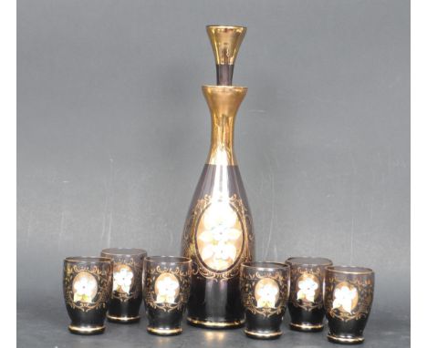 A retro vintage mid 20th century circa 1960s Italian flash glass decanter having a gilt detailing with a polychrome raised fl