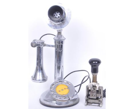 A vintage G &amp; C 20th century candlestick telephone having a circular dialler raised on a round base. Together with a vint