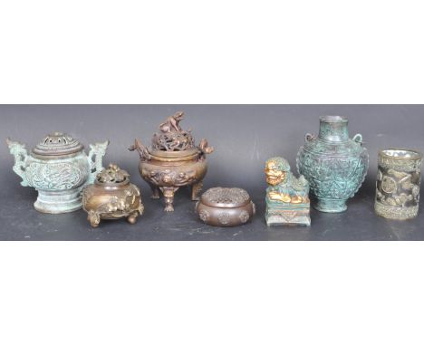 A collection of Chinese metal wares to include lidded censers and dings, pierced metal goblet, locust pot with pierced lid, c