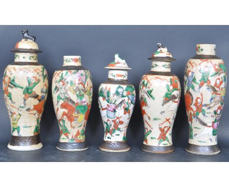 A collection of Chinese Qing dynasty crackle glaze vases. Each of baluster form with waisted necks, decorated with scenes of 