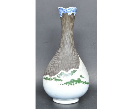 A 20th century ceramic porcelain Japanese vase. The vase of baluster form being decorated with Mount Fuji, raised on a circul