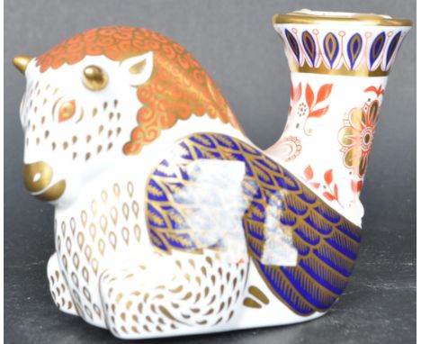 A contemporary Royal Crown Derby imari bison&nbsp; candlestick having polychrome decoration with gilt detailing. Silver stopp