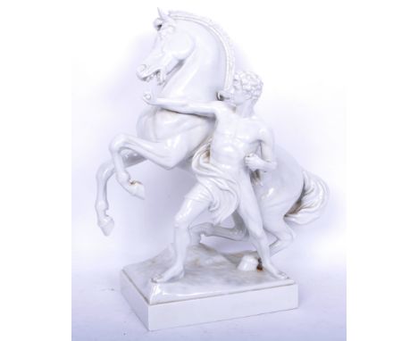 A large vintage 20th century continental porcelain centrepiece ornament of the Marley Horse portraying a man holding a rearin