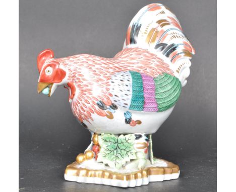 A vintage 20th century Herend porcelain cockerel having red feather decoration and polychrome detailing to the tail raised on