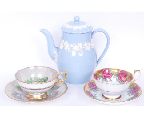 A vintage 20th century Wedgwood Queens Ware coffee/ tea pot together with two cabinet tea cups and saucers to include a Parag