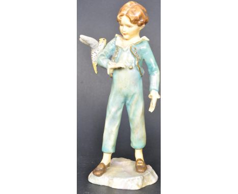 A 20th Century Royal Worcester Figurine ' The Parakeet'. Modelled by F. G. Doughty. Number 3087. Measures 17cm tall.