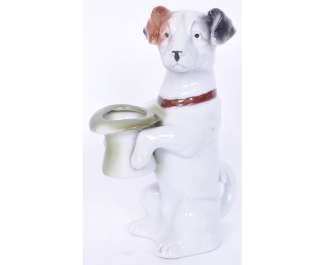 An early 20th century circa. 1940s retro vintage ceramic china matchstick holder in the form of a dog holding a top hat. Meas