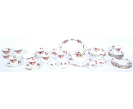 A Royal Albert ' Old Country Roses ' bone china tea service. The service comprising teapot, cups, saucers, plates, egg cups, 