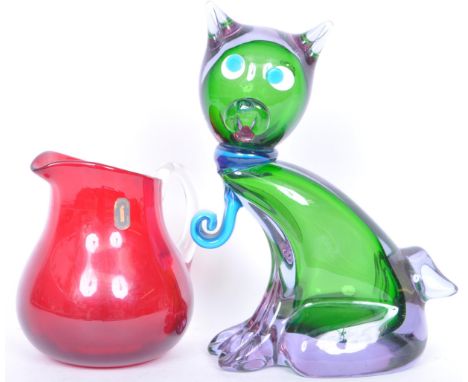 A large mid 20th century Murano art glass cat together with a Whitefriars ruby glass pitcher jug with clear glass handle. Mea