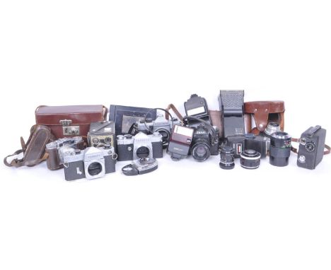 A collection of vintage 20th century camera equipment comprising of a Zenit, Praktica, Paxette, Voigtlander, Werra and Yashic