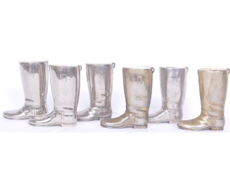 A collection of vintage 20th century white metal shot / spirit measurers in the form of wellington boots. Six in total. Measu