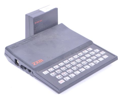 A retro vintage late 20th century Sinclair ZX81 Spectrum computer with keyboard, 18K ram together with a power supply. Measur