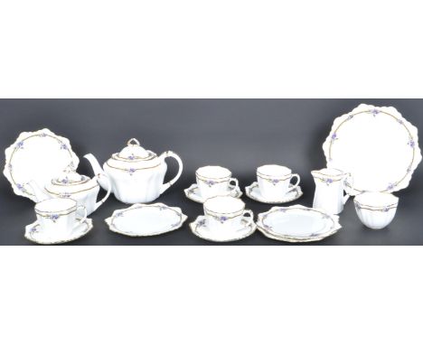 An early 20th century circa 1910 Paragon fine bone china tea service in the Purple Rose pattern comprising of 2 teapots, 4 te