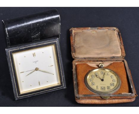 Two vintage 20th Century travel clocks including a Swiss Luxor 8 Day clock of simple square form having a stitched black leat