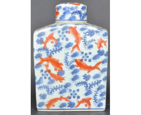 An unusual Chinese porcelain pottery carp / goldfish flask. The shaped bulbous body with scenes of water kelp and carp comple