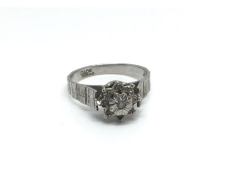 An 18ct white gold ring with floral design and diamonds, ring size approximately O, weight approximately 4 grams.