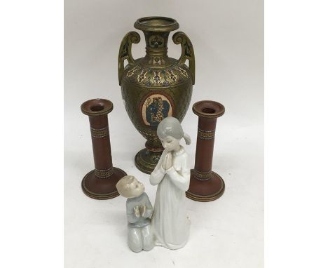 A pair of ceramic candlesticks, a Continental vase and a Lladro figural group of two children praying (4).