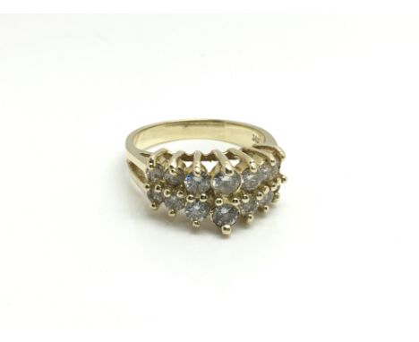 A 14ct yellow gold ring inset with two rows of graduating diamonds, ring size approximately N total weight approximately 4.6 