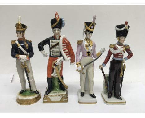 Four military ceramic figures.