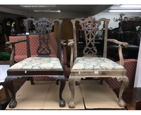 A mahogany dining table with two extra leaves, having a rectangular top with cabriole legs on ball and claw feet. Also includ