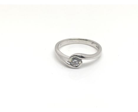 An 18ct white gold ring inset with a .32ct solitaire diamond, total weight approximately 4 grams, ring size approximately N.