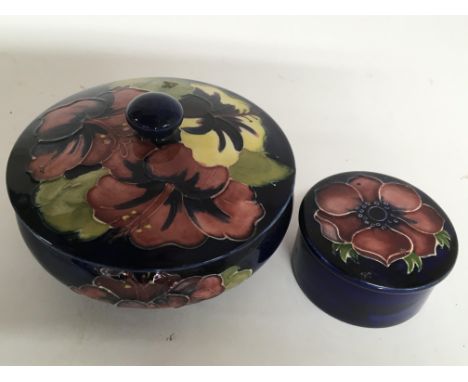 A Moorcroft Hibiscus pattern trinket box and a smaller anemone pattern example