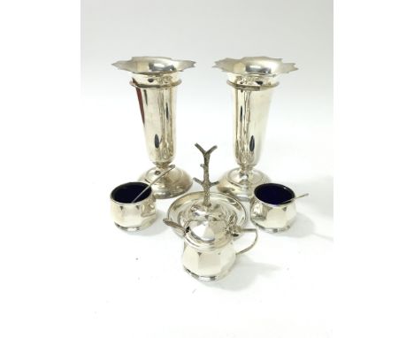 Two silver vases, a condiment trio hallmarked for Birmingham and a ring tree hallmarked for Chester.