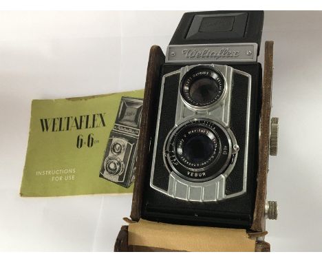 A Vintage Weltaflex twin lens box camera, 6x6cm in a leather Weltaflex case with instruction manual.