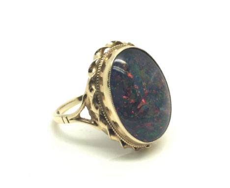 A ladies 9ct yellow gold ring inset with a doublet opal, total weight approximately 5.5 grams, ring size R.