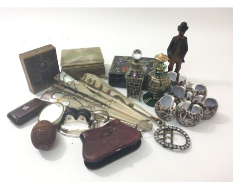 A collection of oddments to include a snuff box, cased cards, two fans, a figure of a man, boxes, a belt buckle etc.