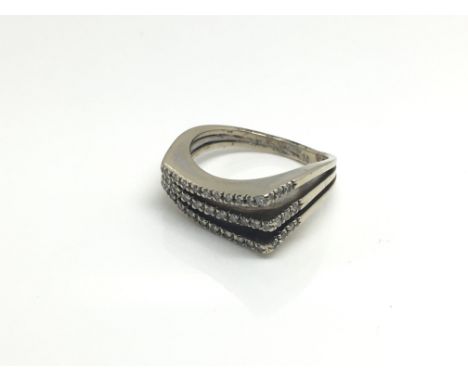 A ladies 18ct white gold diamond ring of unusual design, total weight approximately 7 grams, ring size approximately L/M.