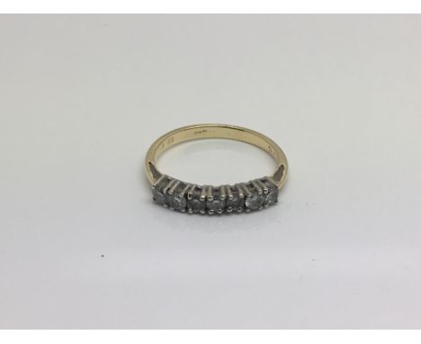 An 18ct yellow gold ring inset with seven diamonds, total weight approximately 2.3 grams, ring size approximately M, with gem