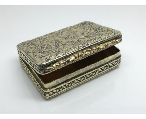 A fine quality Georgian silver gilt snuff box , the lid decorated in relief with a Classical scene of a maiden and cherubs, t