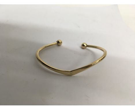 A 9ct gold bangle. Weight approx 12.3g