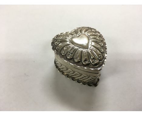 A silver heart shaped trinket box with hallmarks for Birmingham, attributed to D&F.