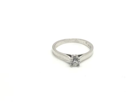 A ladies 18ct white gold ring inset with a single 0.24ct diamond, total weight approximately 2.5 grams, ring size approximate