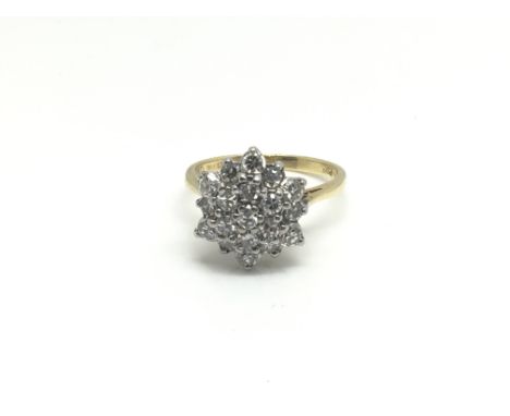 A ladies 18ct yellow gold ring inset with a flower of diamonds, total weight approximately 3.5 grams, ring size approximately