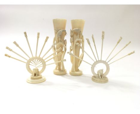 Two carved ivory spill vases decorated with herons and two cocktail stick sets with central elephants (a/f) (4).