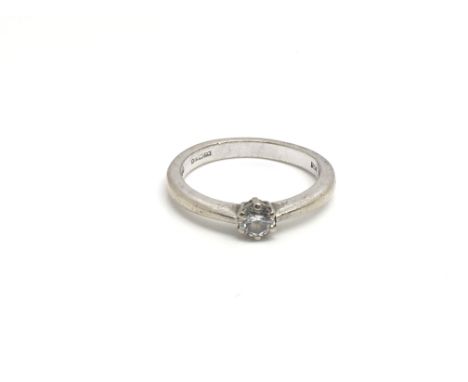 An 18ct white gold ring inset with a .25ct diamond, total weight approximately 3.5 grams, ring size approximately K.