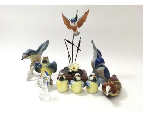 A collection of bird figures to include Swarovski, Goebel and Copenhagen.