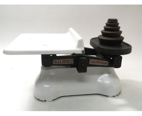 A set a metal and white ceramic grocers scales attributed to W & T Avery Ltd, Birmingham, missing one ounce weight.