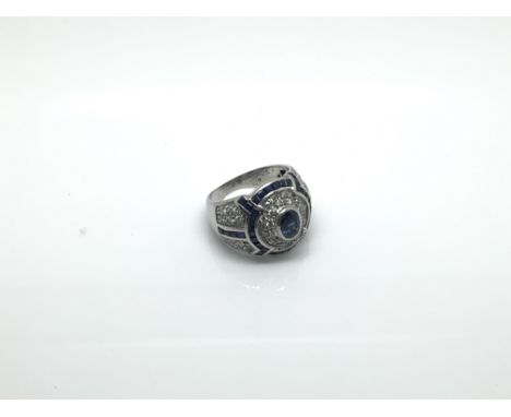 An 18ct white gold diamond and sapphire cluster ring, approximate ring size M/N, total approximate weight 8.5 grams.