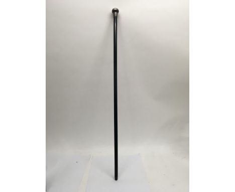 A monogrammed white metal topped walking stick. Length approx 89cm.