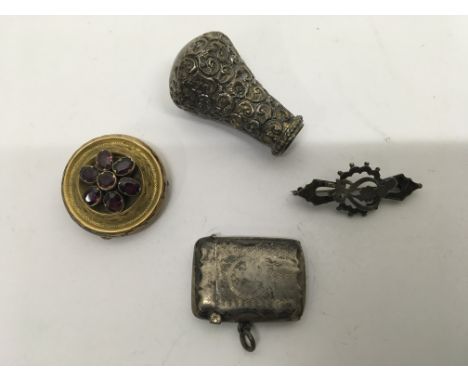 A pinchback brooch, vesta case, silver brooch and a walking stick top.