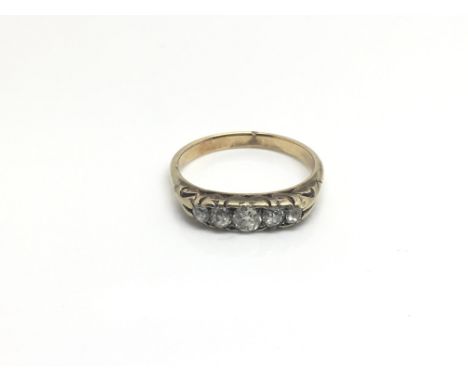 A ladies 18ct yellow gold ring inset with a row of five diamonds, total weight approximately 3 grams, ring size approximately