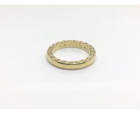 An unusual 18ct yellow gold eternity ring, the diamonds set on the top, total weight approximately 6 grams, ring size approxi