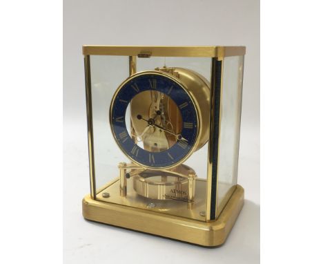 A Jaeger LeCoultre atmos clock with blue marbled dial having Roman numerals, approx 20cm x 23cm x 15.5cm.