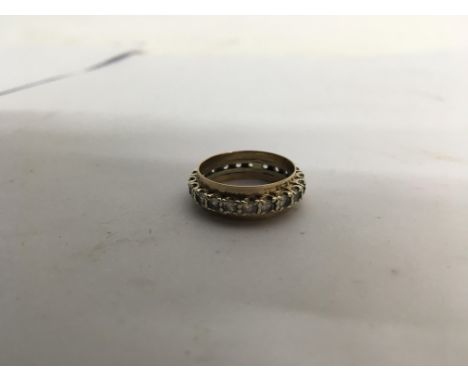 A gold, spirals, eternity ring. Weight 4.1g Size approx Q