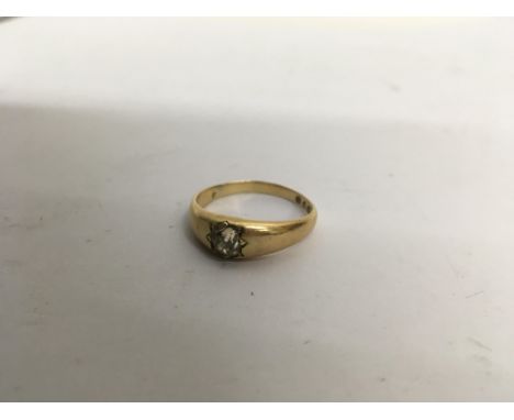 An 18ct gold gents ring with a solitaire diamond. Weight approx 7.7g Size approx 2.