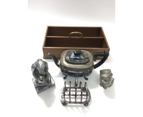 A vintage 'Boby' money box, a chrome monkey and silver plated teapot and toast rack.